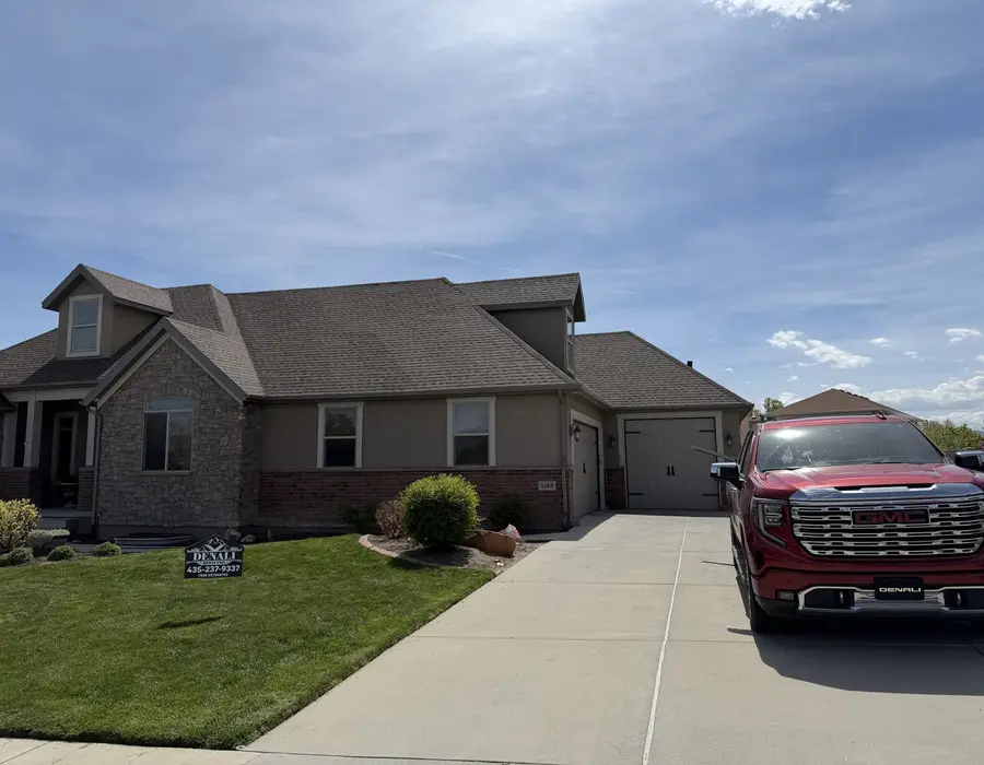 Finished shingle roof on a Utah home with the Denali Roofing truck out front