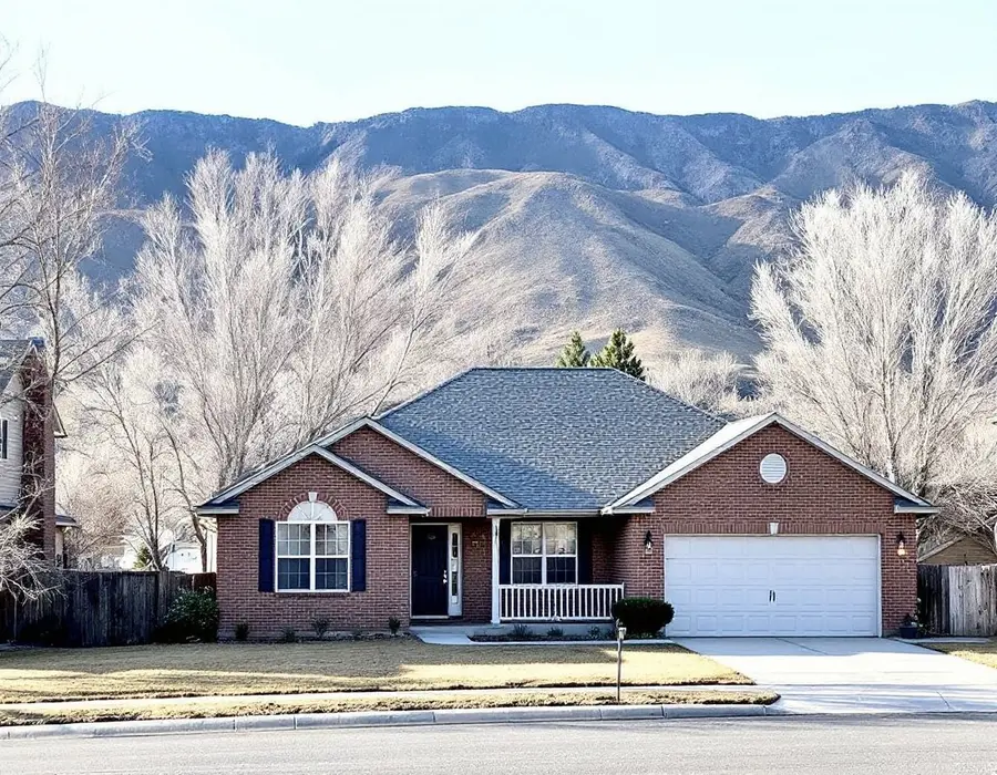 Brick rambler on a Centerville bench street with the Wasatch foothills behind